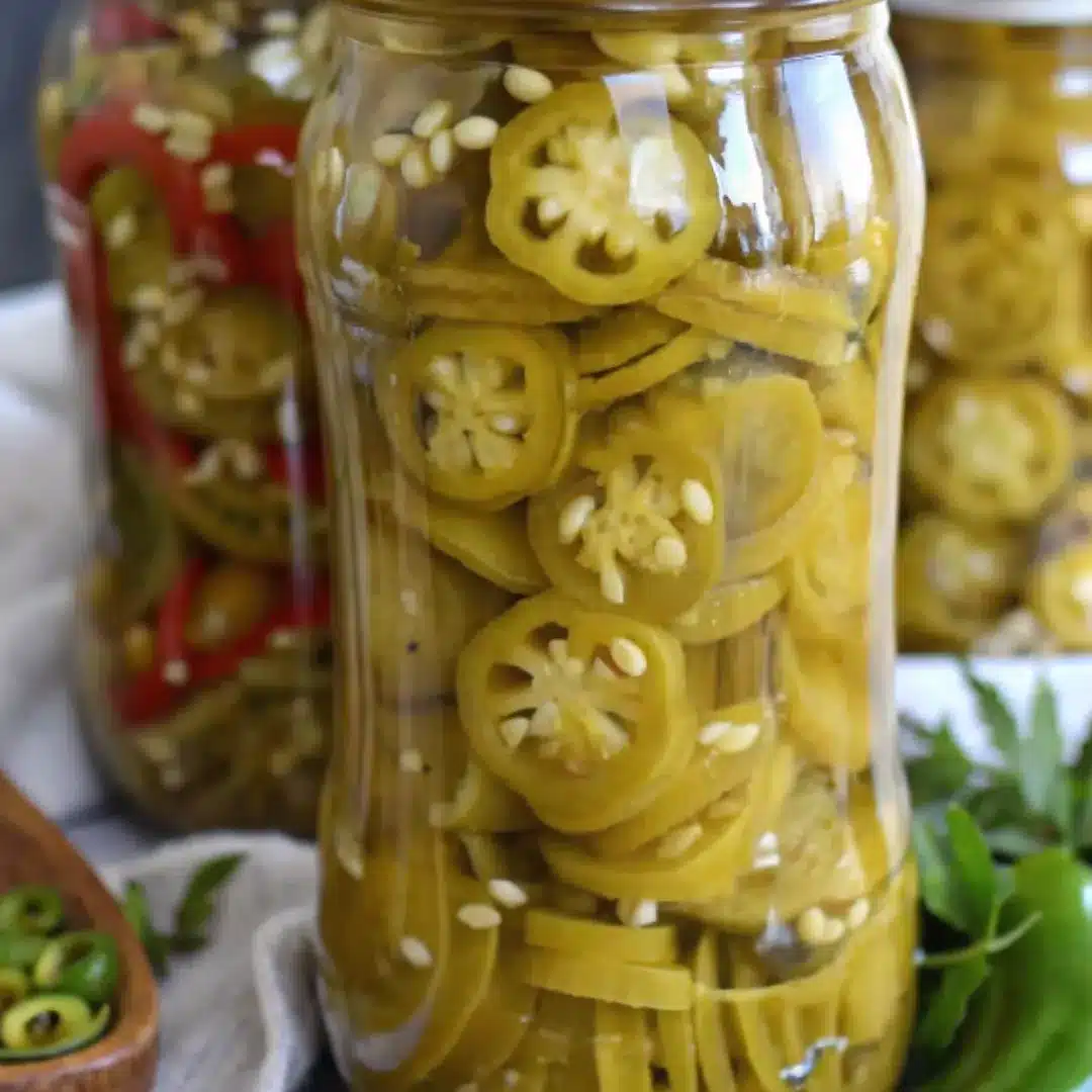 Homemade Canned Jalapenos in Glass Jars Sliced canned jalapenos packed in glass jars