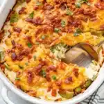 Portion of creamy casserole scooped out with a spoon