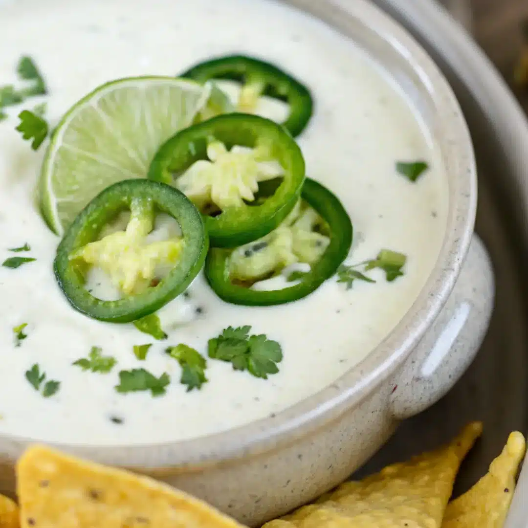 Chuy’s Jalapeño Ranch Dip – Creamy, Zesty, and Spicy Creamy jalapeño ranch dip topped with fresh jalapeño slices, lime, and cilantro