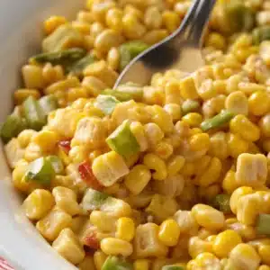 Jalapeno Corn: The Ultimate Flavorful Guide to Spicy-Sweet Recipes 3 Creamy jalapeno corn being scooped from a bowl
