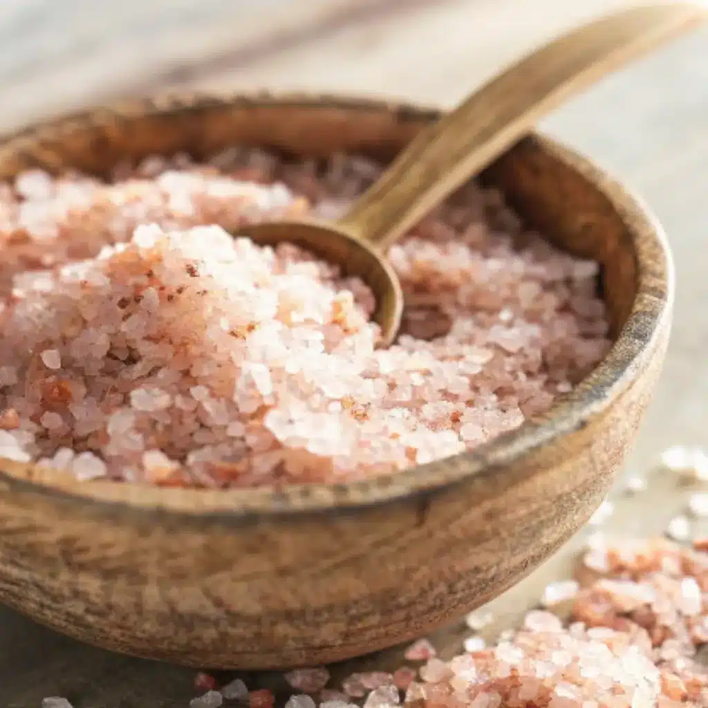 Pink Salt Mounjaro Granules in Rustic Wooden Bowl Pink salt mounjaro granules in rustic wooden bowl with spoon