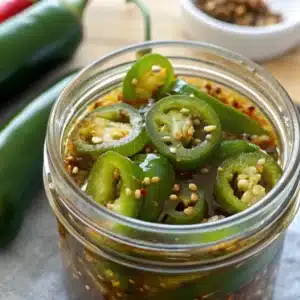 Preserving Jalapenos: The Ultimate Guide to Keep Them Fresh Long-Term 15 Pickled jalapenos in a glass jar with spices – preserving jalapenos